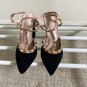 Black suede studded block heel closed toe shoe.